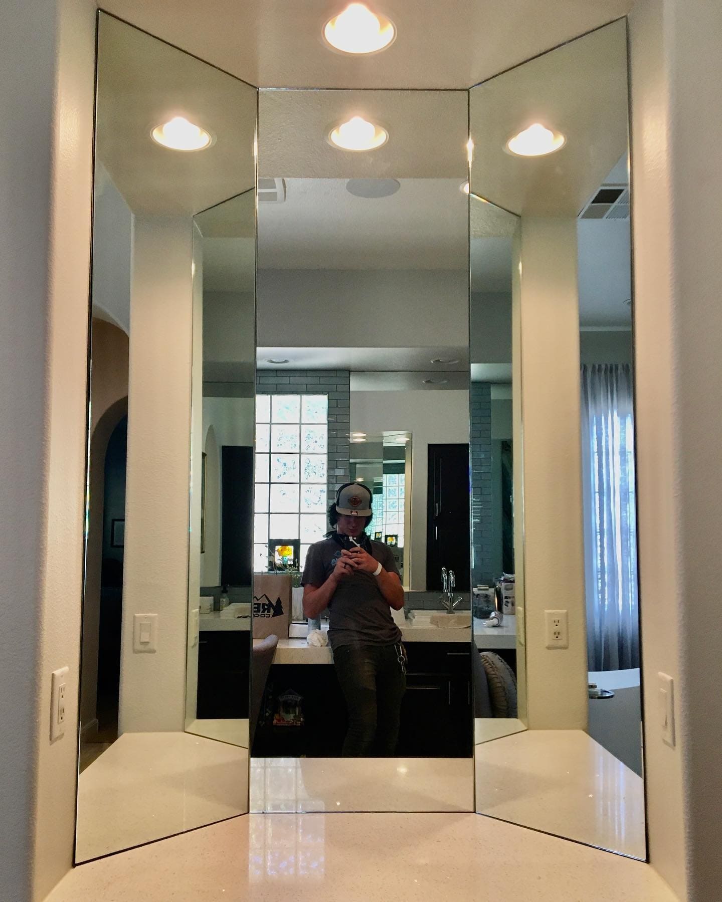 Custom three-panel beveled vanity mirror installation above bathroom countertop in a Las Vegas home by Shower Glass Las Vegas